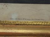 an image of a gold frame with a picture of a bird on it