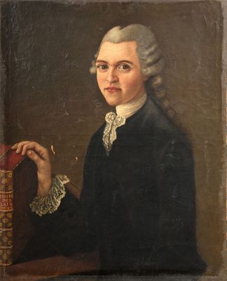 portrait of a man in a black coat holding a book