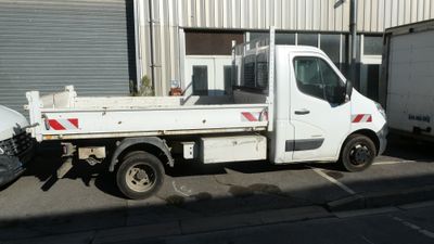 a white truck that is parked in front of a building
