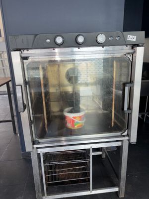 an oven with a bowl of food inside of it