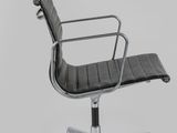 a black leather office chair with a chrome steel frame and armrest