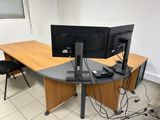 an image of a desk with two monitors and a keyboard