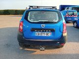 a small blue car parked in a parking lot
