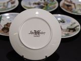 a white plate with a picture of a farm scene on it