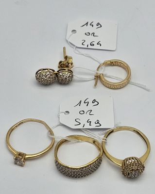 three pairs of gold rings and a pair of diamond earrings