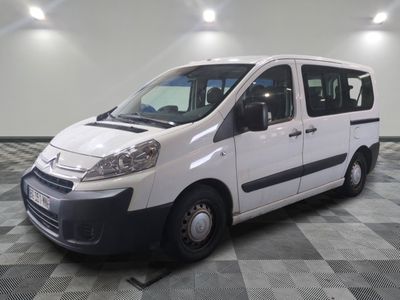 a white van that is parked on a checkered floor