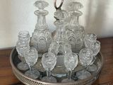 a silver tray with a lot of glasses on it
