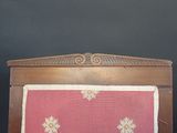 a bed with a pink and white blanket on top of it