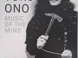 a black and white photo of a woman holding a hammer