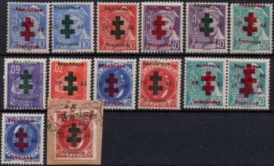 several different types of stamps with crosses on them on a black surface