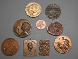 several different types of coins are shown on a gray surface
