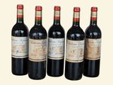 six bottles of wine are lined up in a row
