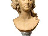 marble bust of a woman on a marble pedestal on a marble table