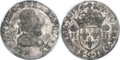 a close up of a coin with a crown on top of it