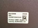 the back of a laptop computer with a sticker on it