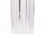 a clear glass vase with a toothbrush in it