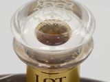 a close up of a bottle of liquor on a plate