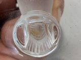 a person holding a plastic object in a bowl of water