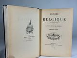 an open book with a drawing of a castle on the cover