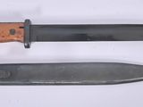 two knives that are laying side by side on a table