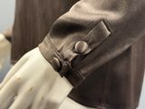 une photo d'un mannequin portant une veste marron