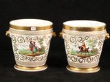 pair of antique porcelain vases with gold trimmings on them