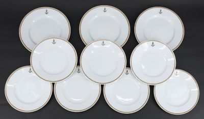 six white and gold china plates with gold rims