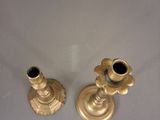 pair of antique brass candlesticks on a white background