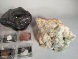a rock, a rock, and some small rocks on a table