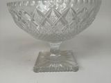 an image of a clear glass bowl with a base on a white background