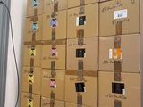 many boxes stacked on top of each other in a room