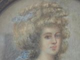 painting of a woman with a large hat in a silver frame