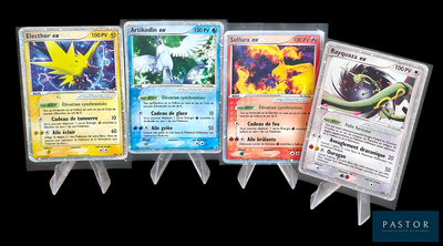 Plusieurs cartes Pokémon sont alignées les unes à côté des autres sur un fond noir.