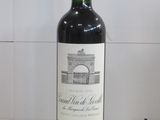 a bottle of wine that is sitting on a table