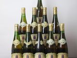 several bottles of wine sitting on top of a wooden table