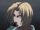 un personnage masculin d'anime aux cheveux blonds et portant une chemise bleue