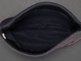 a close up of a hat on a table with a black background