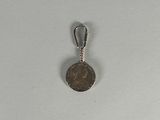 an image of a coin with a keychain on a white surface