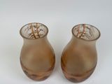 two vases that are sitting next to each other