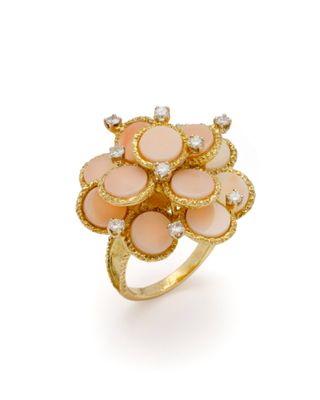 une image représentant une bague en or sertie de pierres roses et de diamants