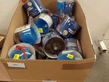 a cardboard box full of cans and cans of soda
