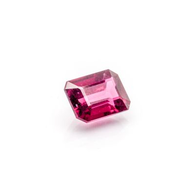 a pink tourmaline stone on a white background