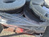 a pile of brushes sitting on top of a pallet