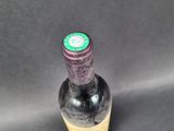 a bottle of wine that is sitting on a table