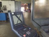 a laptop that is sitting on a machine in a factory