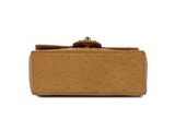 an image of a brown purse on a white background