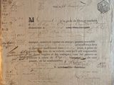 an old document with writing on it sitting on a table