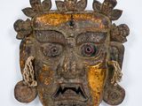 an image of a wooden mask on a white background