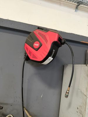 a hose attached to a wall in a garage