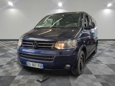 a picture of a blue van parked in a garage